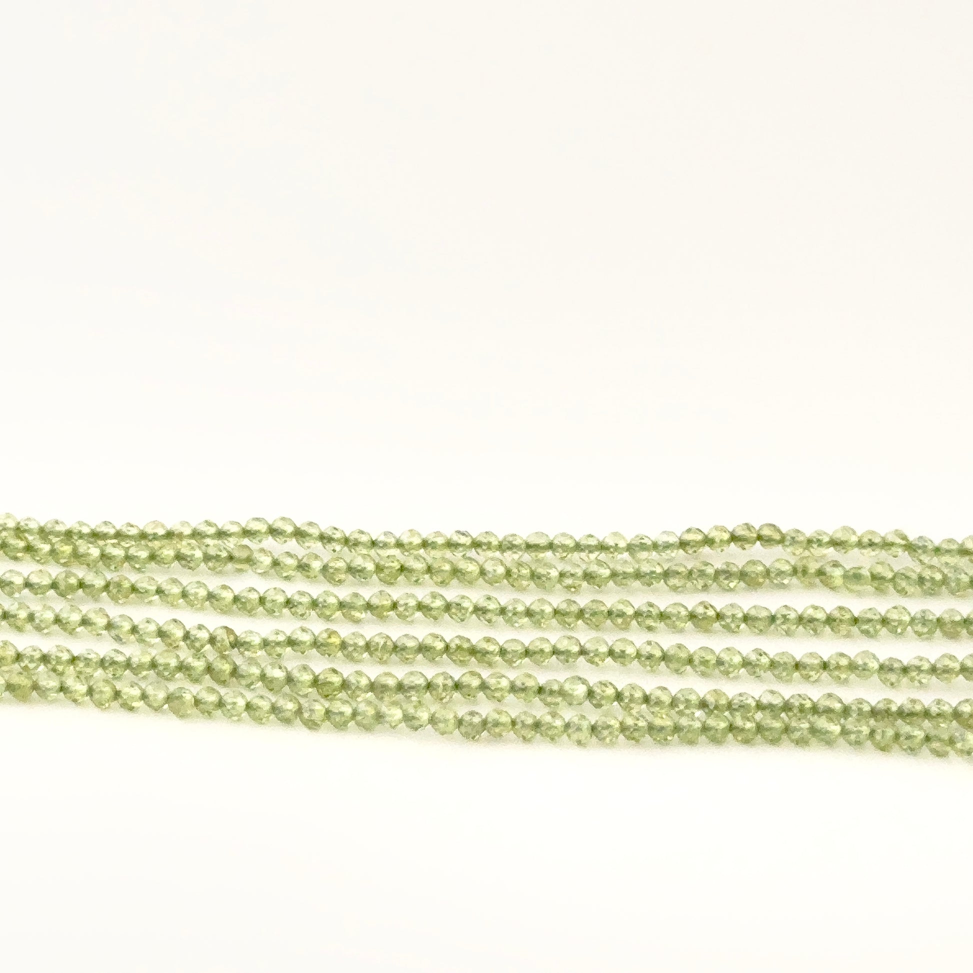 Authentic Peridot gemstone beads, 2.1–2.2mm faceted rondelles with bright green sparkle for DIY jewellery makers.