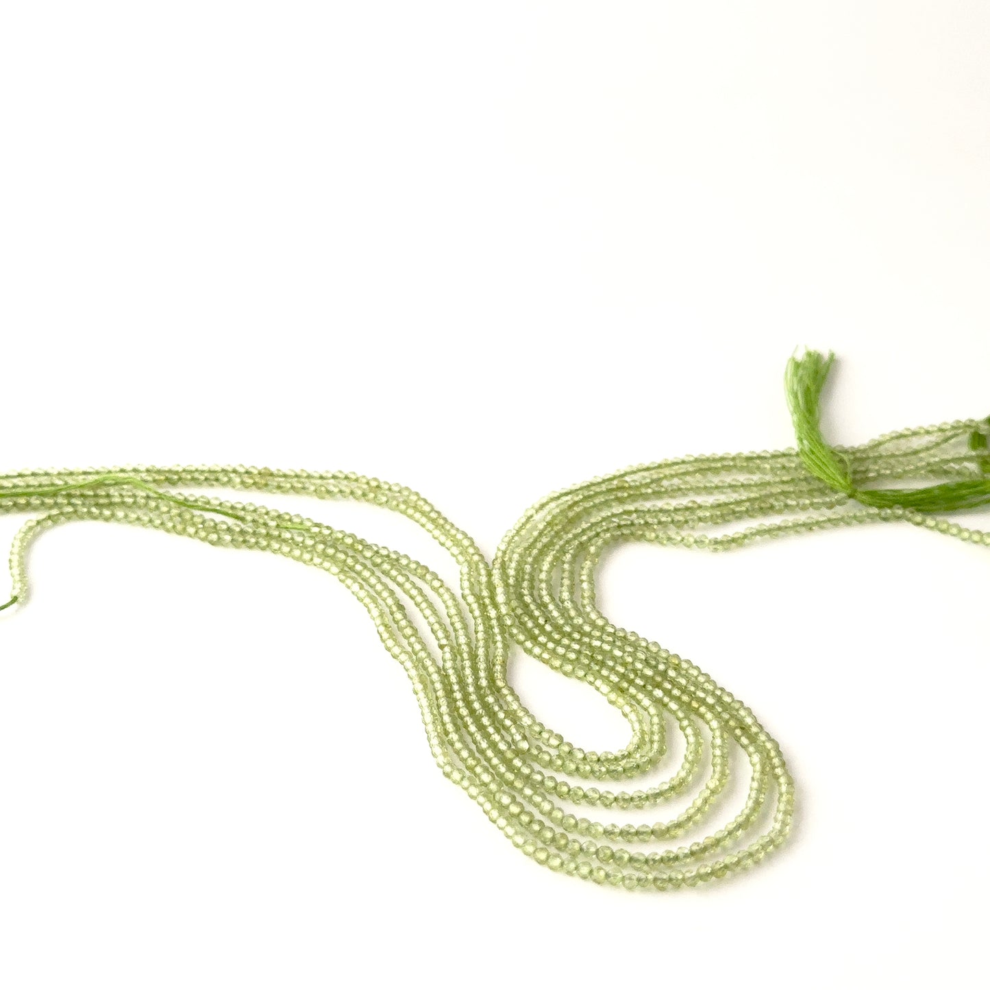 High‑quality Peridot faceted rondelle beads, 2.4–2.5mm, neatly strung on a 31cm strand for jewellery designers.