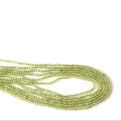 Peridot gemstone beads, 2.1–2.2mm faceted rondelles with bright green colour