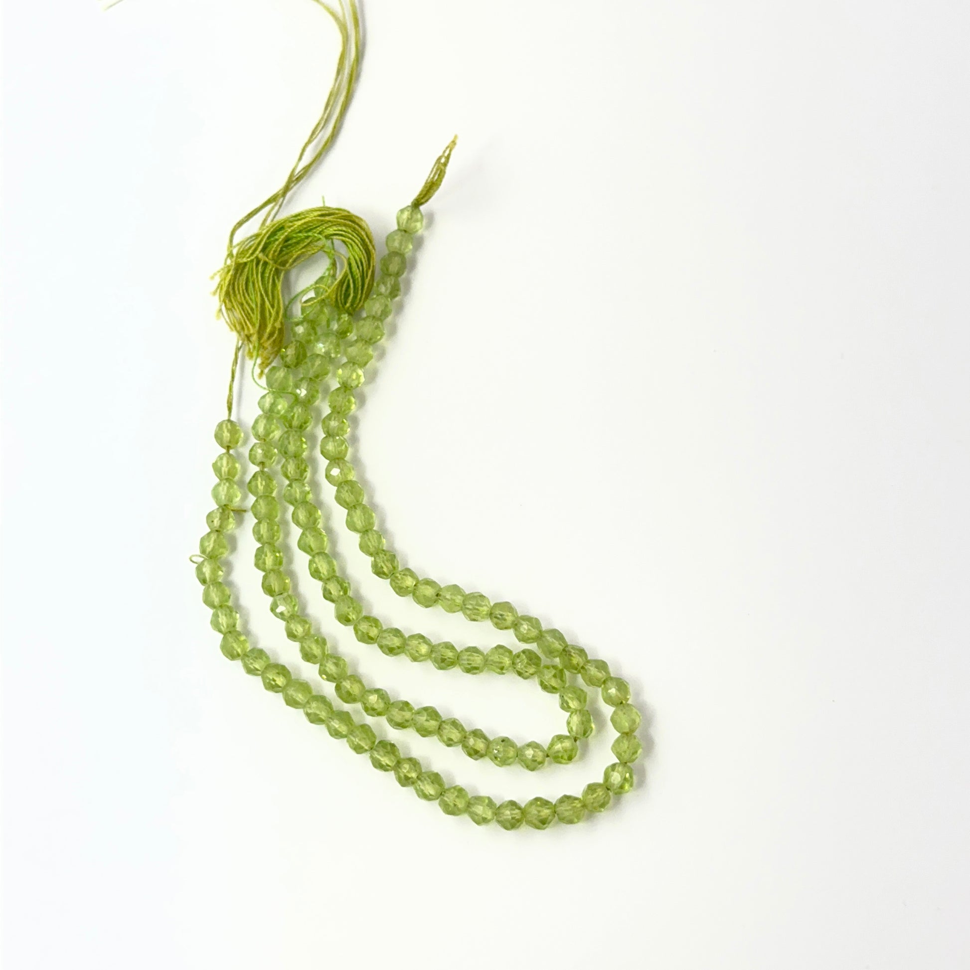Sparkling Peridot rondelle‑cut beads with crisp shine, perfect for genuine gemstone beads in creative designs.