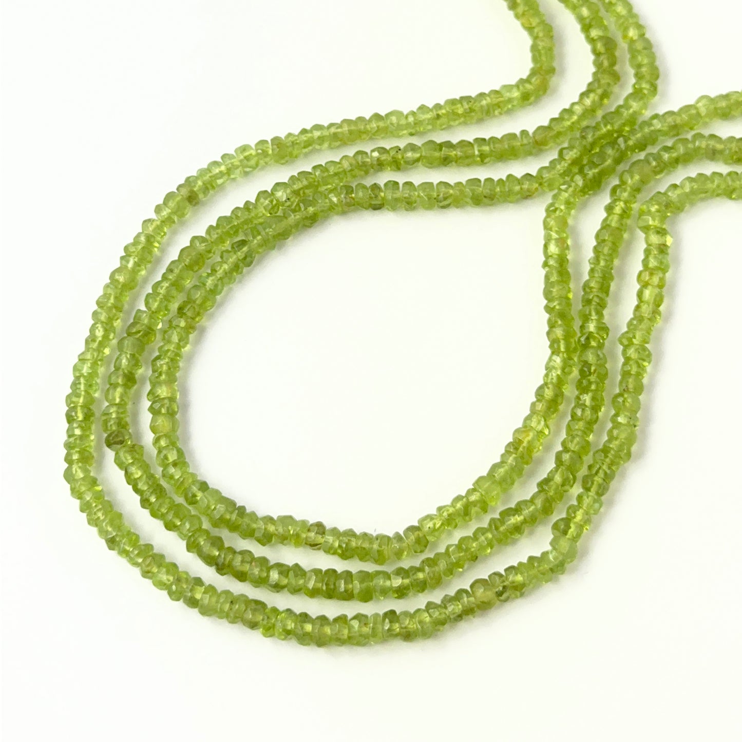 Peridot faceted rondelle beads in 3.7–4.2mm sizes on a 32cm strand, genuine gemstone beads for handmade jewellery.