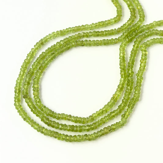 Peridot faceted rondelle beads in 3.7–4.2mm sizes on a 32cm strand, genuine gemstone beads for handmade jewellery.