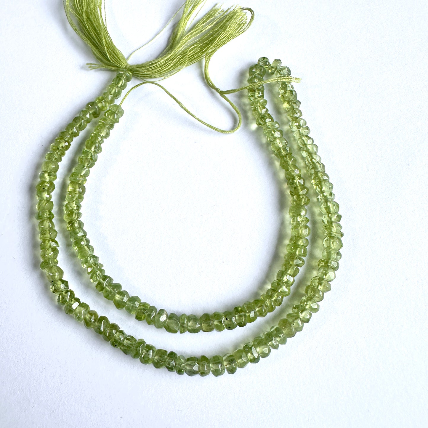 Natural gemstone beads featuring Peridot with precision faceting and vibrant green tones.