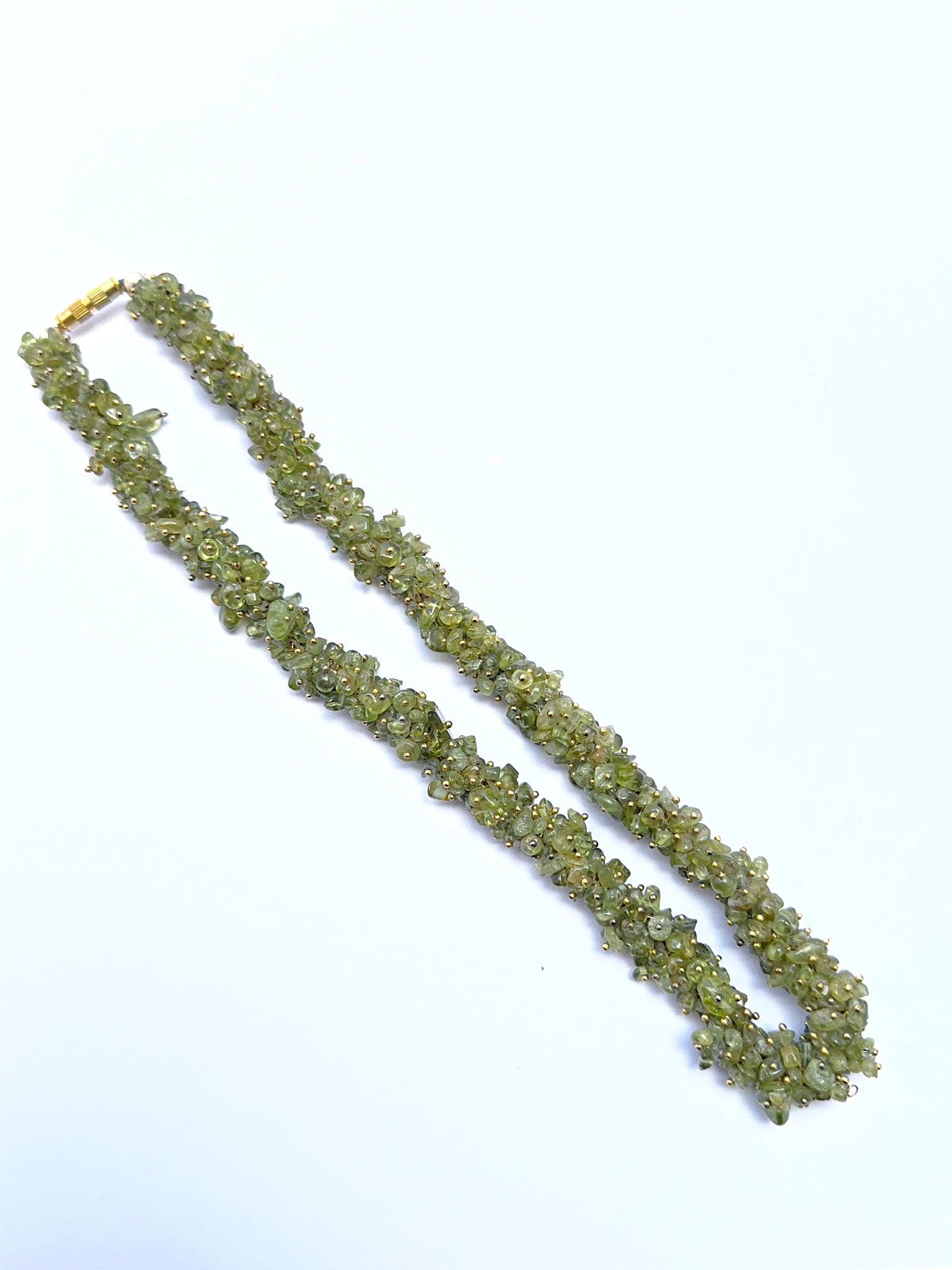 Peridot chip necklace featuring irregular polished stones in a lively layout.