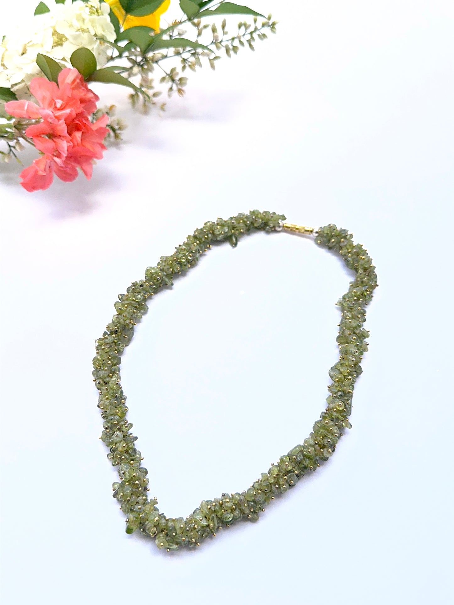 Natural peridot necklace with bright green chip beads showing fresh sparkle.