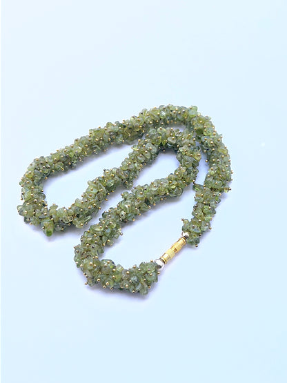 Green peridot necklace with chip beads offering natural shine and texture.