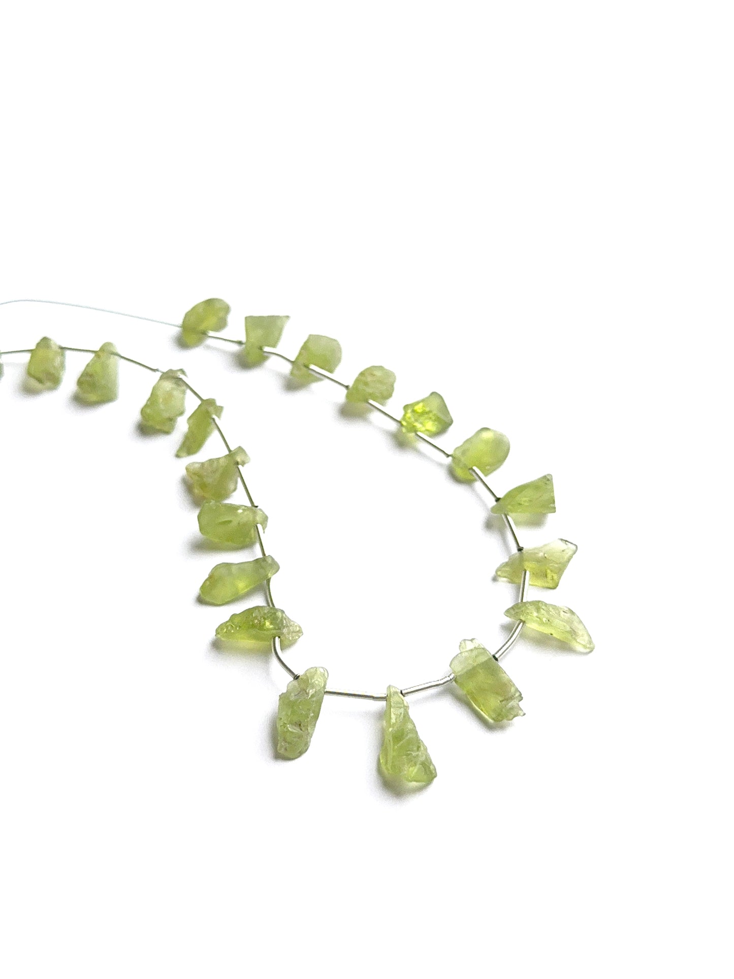 Close‑up of amethyst faceted rondelles highlighting their polished cut and natural gemstone shine.