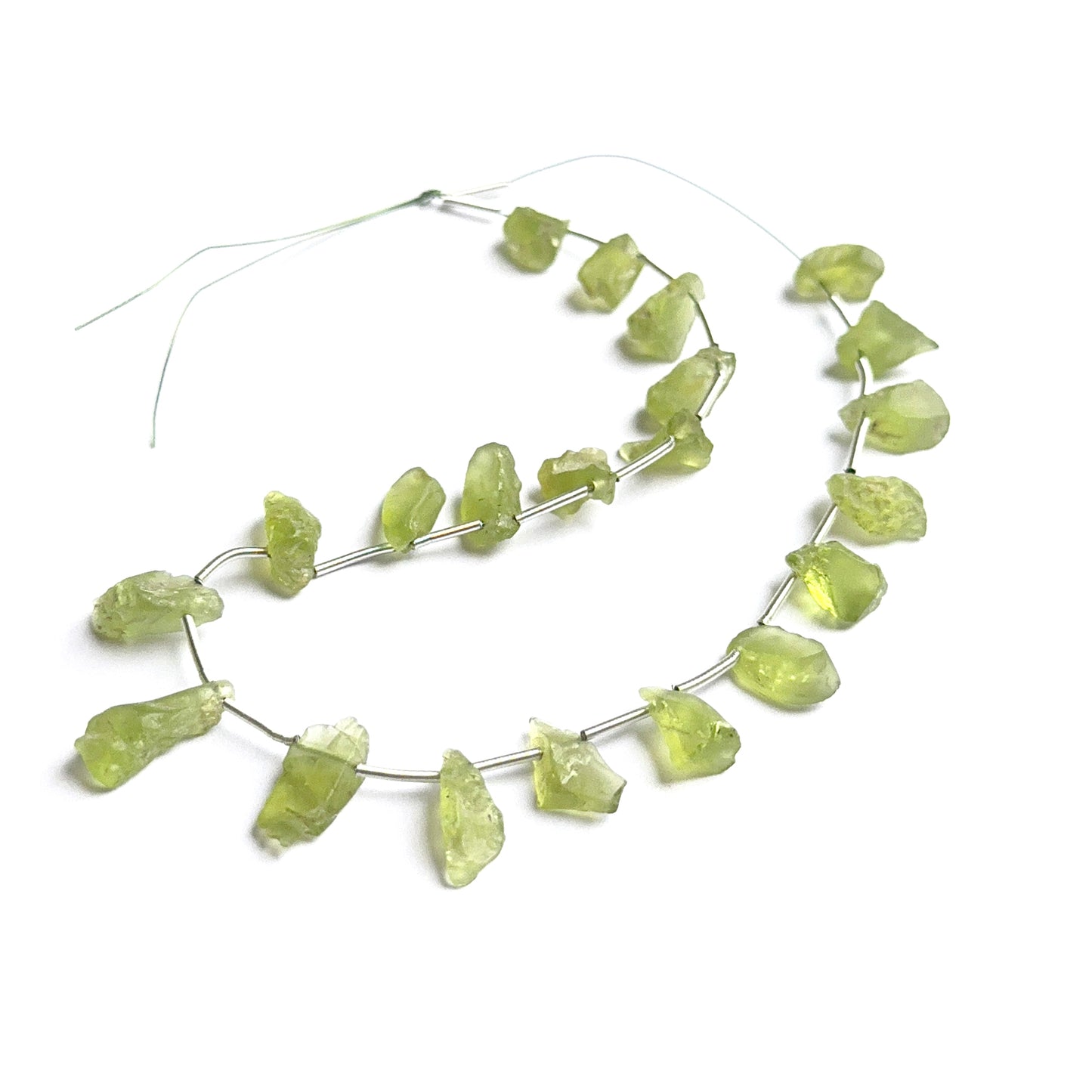 Amethyst gemstone rondelles arranged neatly to showcase clarity, colour and precision faceting.