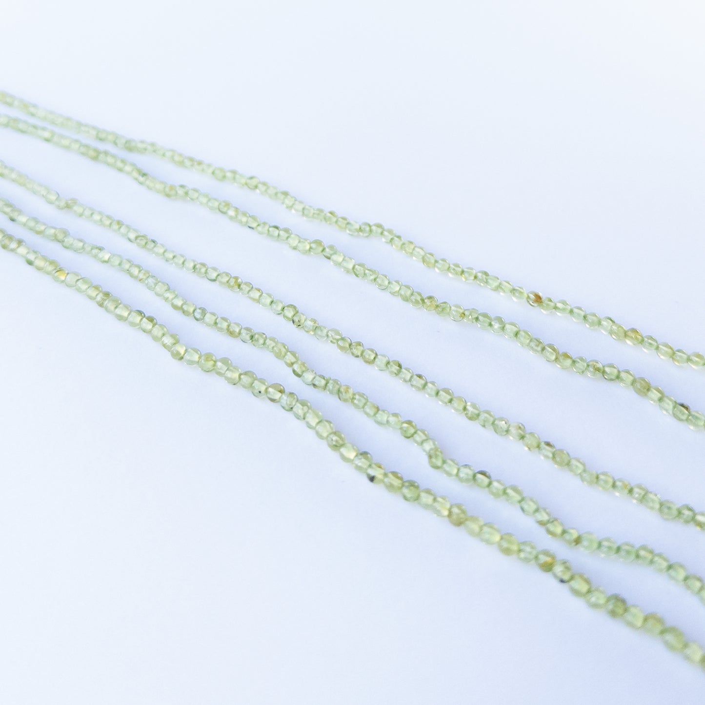 High quality Peridot round stone beads, polished finish offering elegant colour and brilliance.