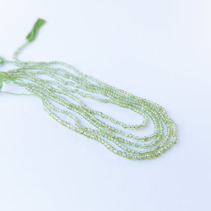 Smooth round Peridot beads with vivid green hues, perfect gemstone beads for DIY jewellery making.