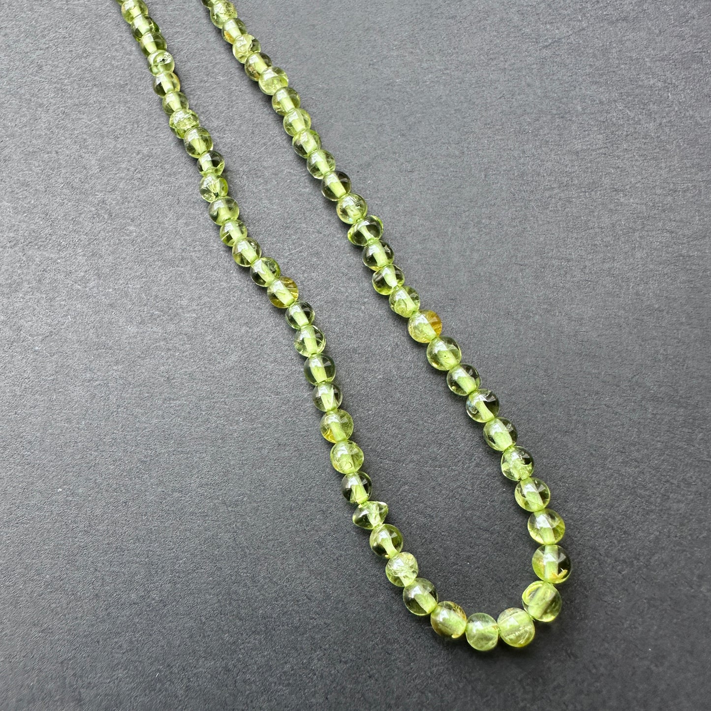 Stone Beads in Peridot with polished smooth round cut for handmade jewellery components.