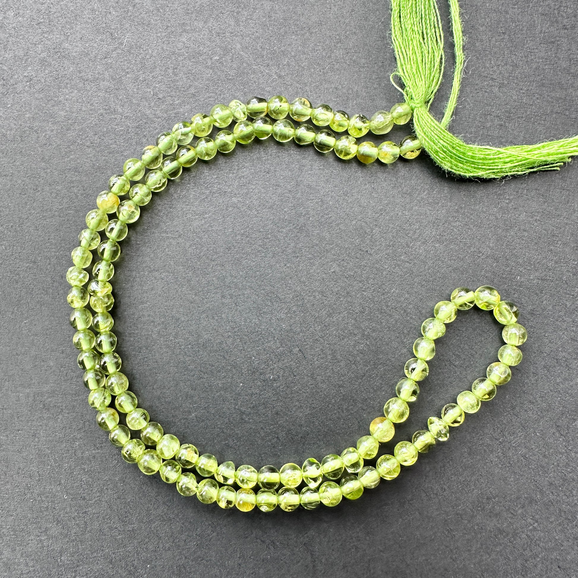 Natural gemstone beads in Peridot, 3.5mm size, ideal for fresh and elegant DIY jewellery designs.