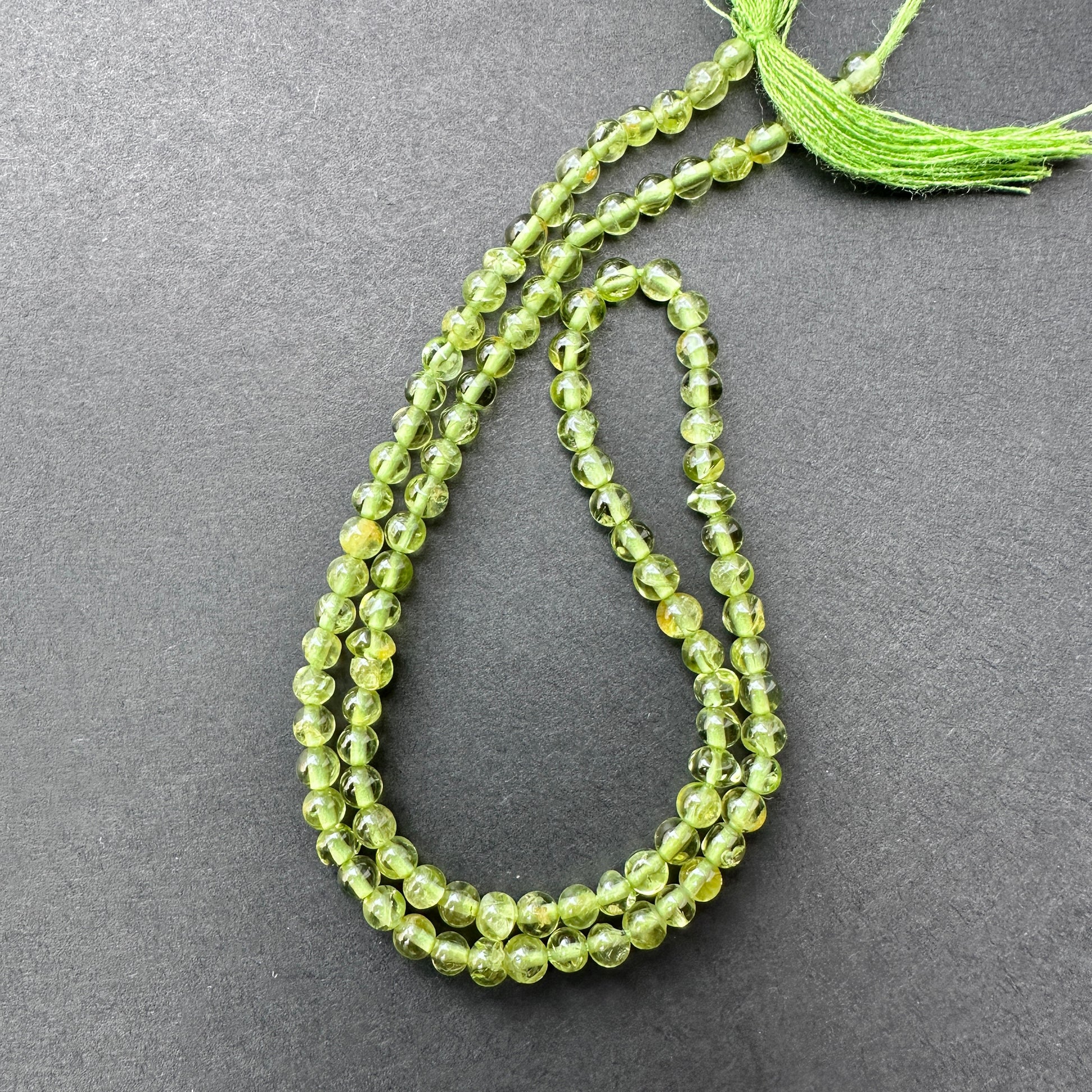 Handmade jewellery components featuring Peridot beads with consistent size and lustrous finish.