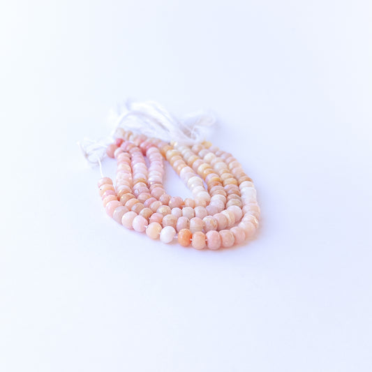 Peruvian Opal faceted rondelles displaying calming hues and premium craftsmanship in a delicate strand.