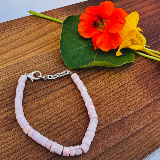 Pink Opal bracelet with smooth wheel-cut beads in soft blush and peach tones.