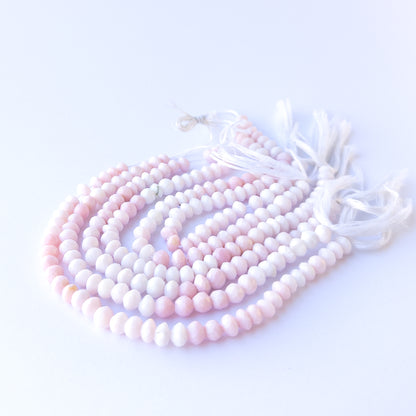 Genuine stone beads in soft blush tones, featuring faceted rondelles for DIY jewellery making.