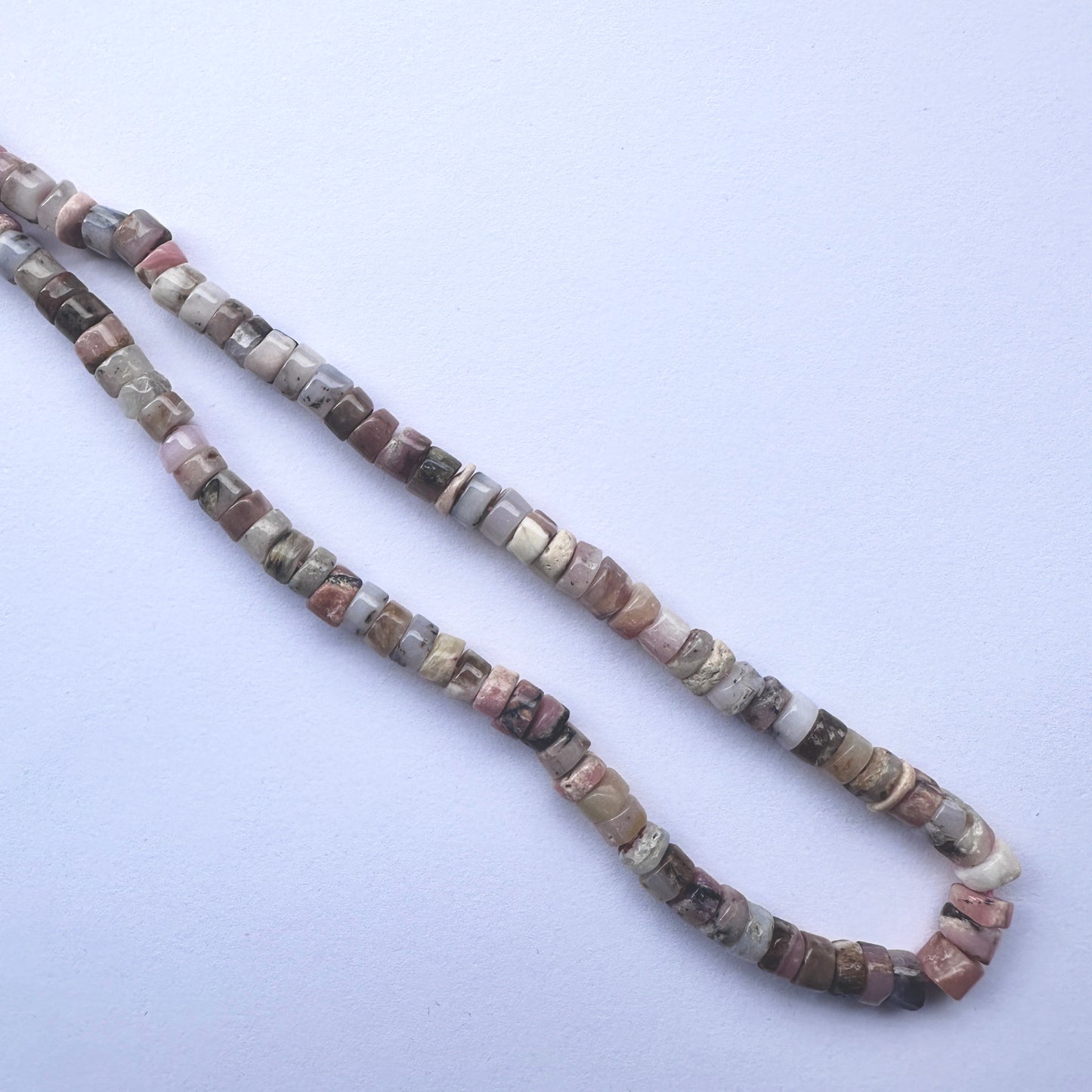 Handmade jewellery components made from 6mm Pink Opal beads with 0.5mm drilled holes.
