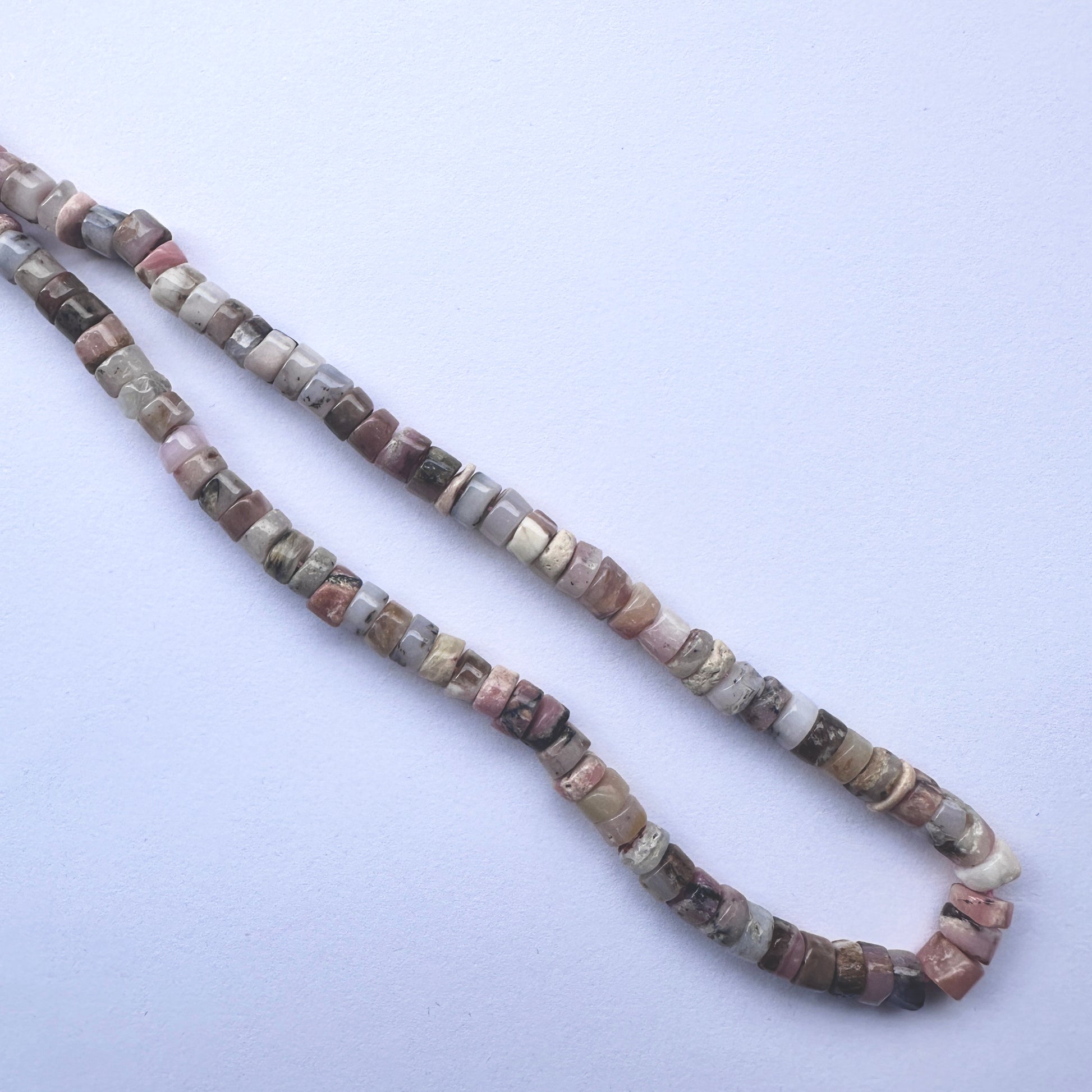 Handmade jewellery components made from 6mm Pink Opal beads with 0.5mm drilled holes.