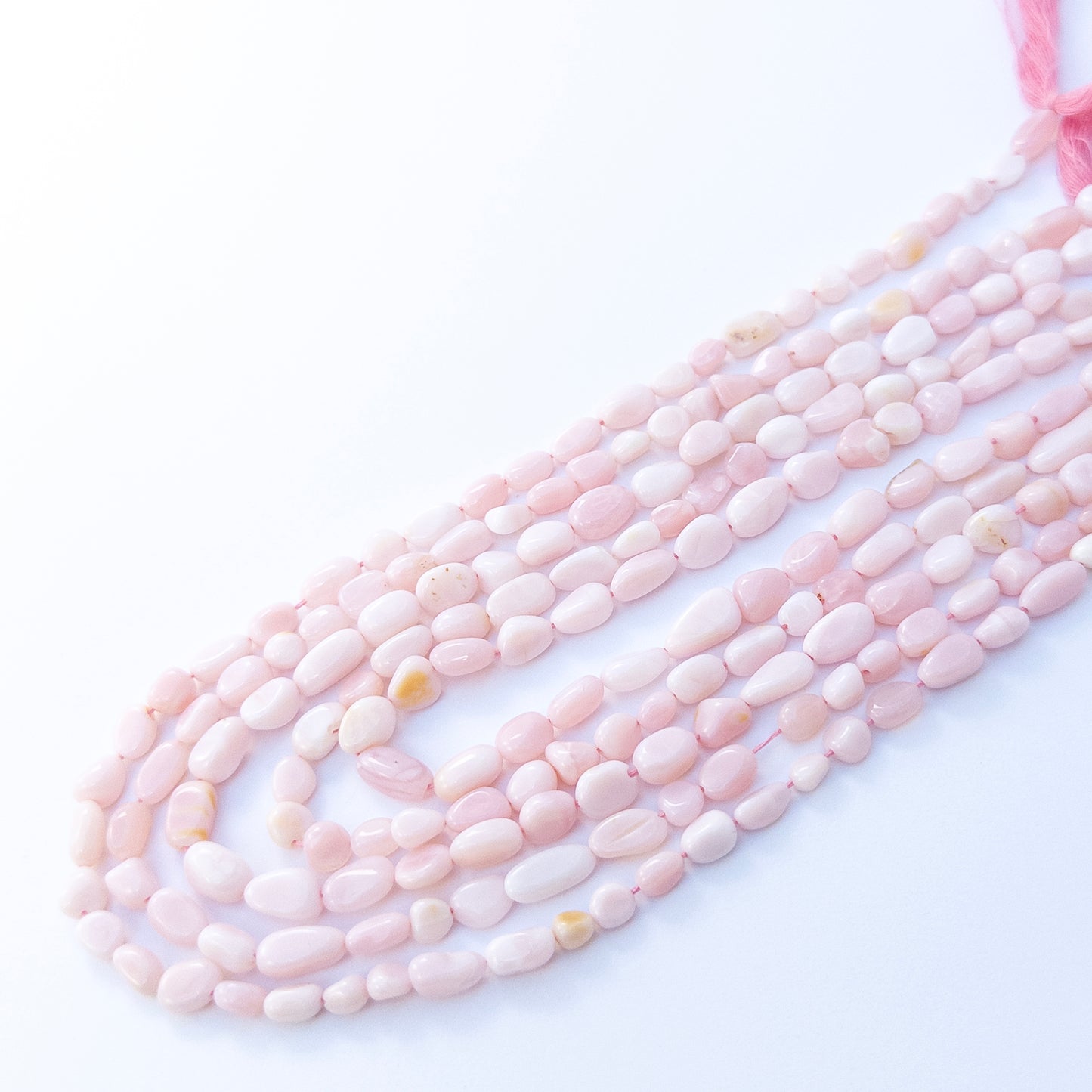 Genuine Pink Opal smooth tumble beads with soft shimmer, ideal for handmade jewellery components.