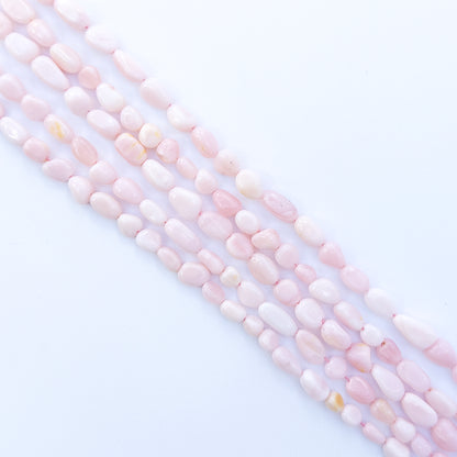 Pink Opal smooth tumble 4–5mm gemstone, showcasing their smooth tumble design and sparkle.



