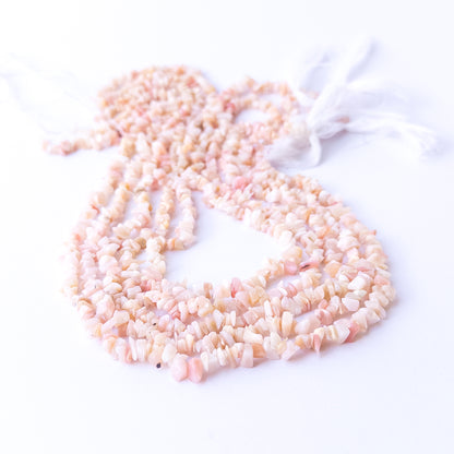 Pink Peruvian Opal chip beads arranged on a 42cm strand showcasing soft pastel tones for handmade jewellery components.