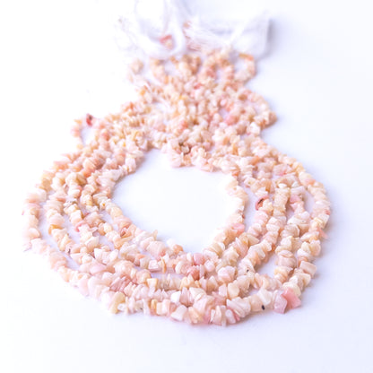 Close‑up of Pink Peruvian Opal gemstone chip beads highlighting natural texture and soft colour variations.