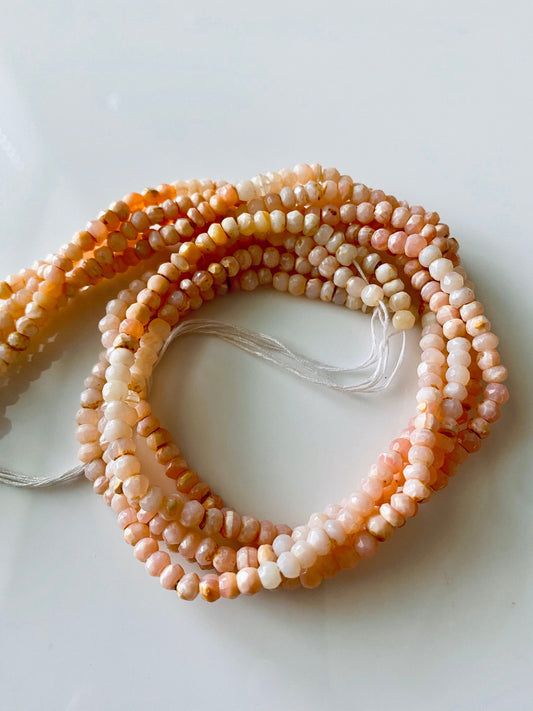 Elegant arrangement of Pink Peruvian Opal beads, highlighting subtle pink variations and clarity.