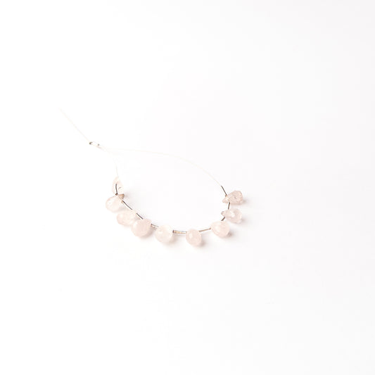 Handmade jewellery components crafted from Pink Quartz briolette beads with a soft luminous appearance.
