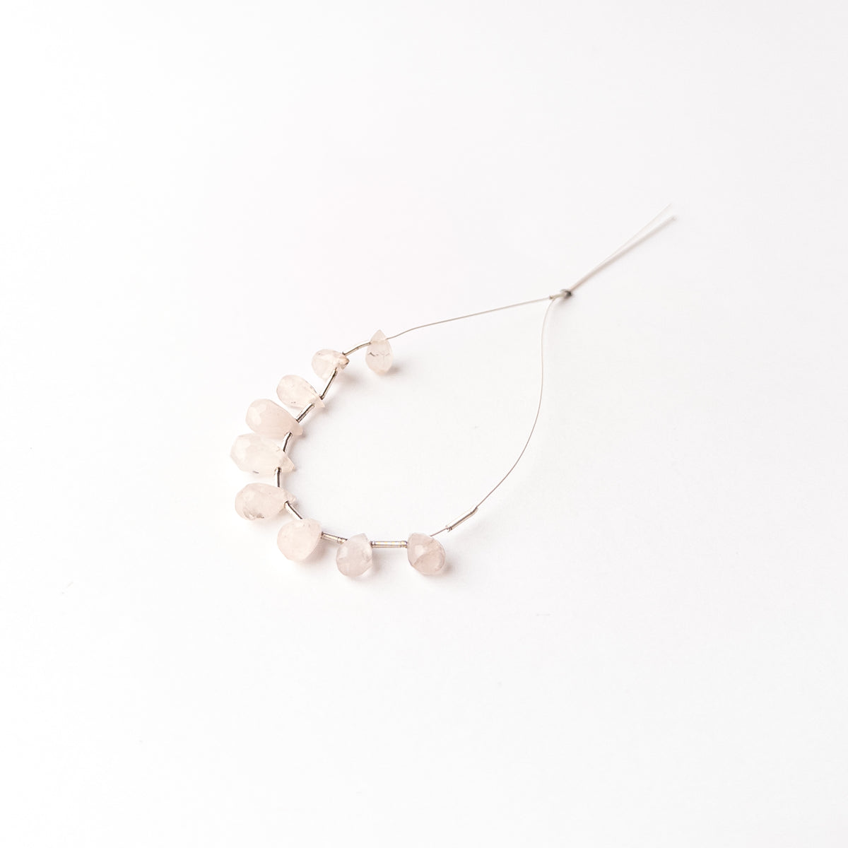 Faceted Pink Quartz briolette beads perfect for creating elegant earrings pendants and bespoke jewellery pieces.