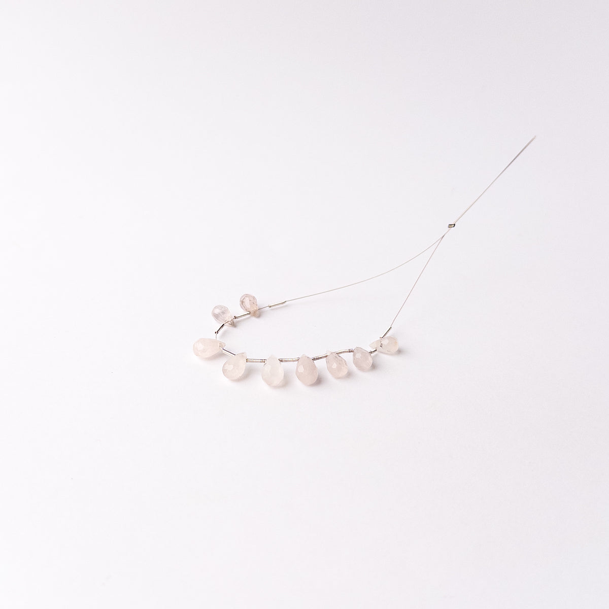 Authentic Pink Quartz stone beads featuring faceted briolette cuts ideal for delicate handmade jewellery designs.