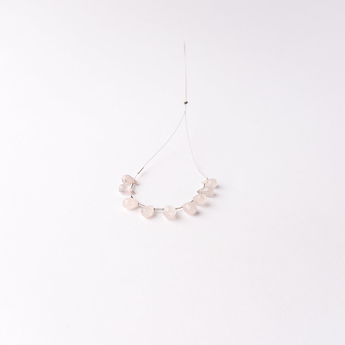 High quality Pink Quartz stone beads showcasing subtle pink hues and precision faceting for added brilliance.