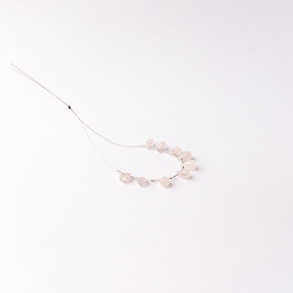 Genuine Pink Quartz gemstone beads arranged as matched briolette pieces with beautiful light-catching facets.