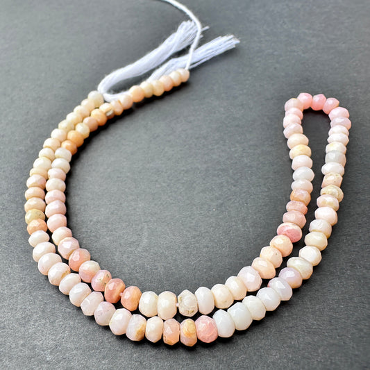 Pink Shaded Opal faceted rondelle beads with soft blush and cream tones arranged on a 32cm strand for jewellery making.