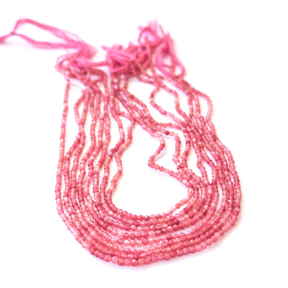 Delicate Pink Strawberry Quartz faceted rondelles showcasing shine and clarity for DIY gemstone designs.