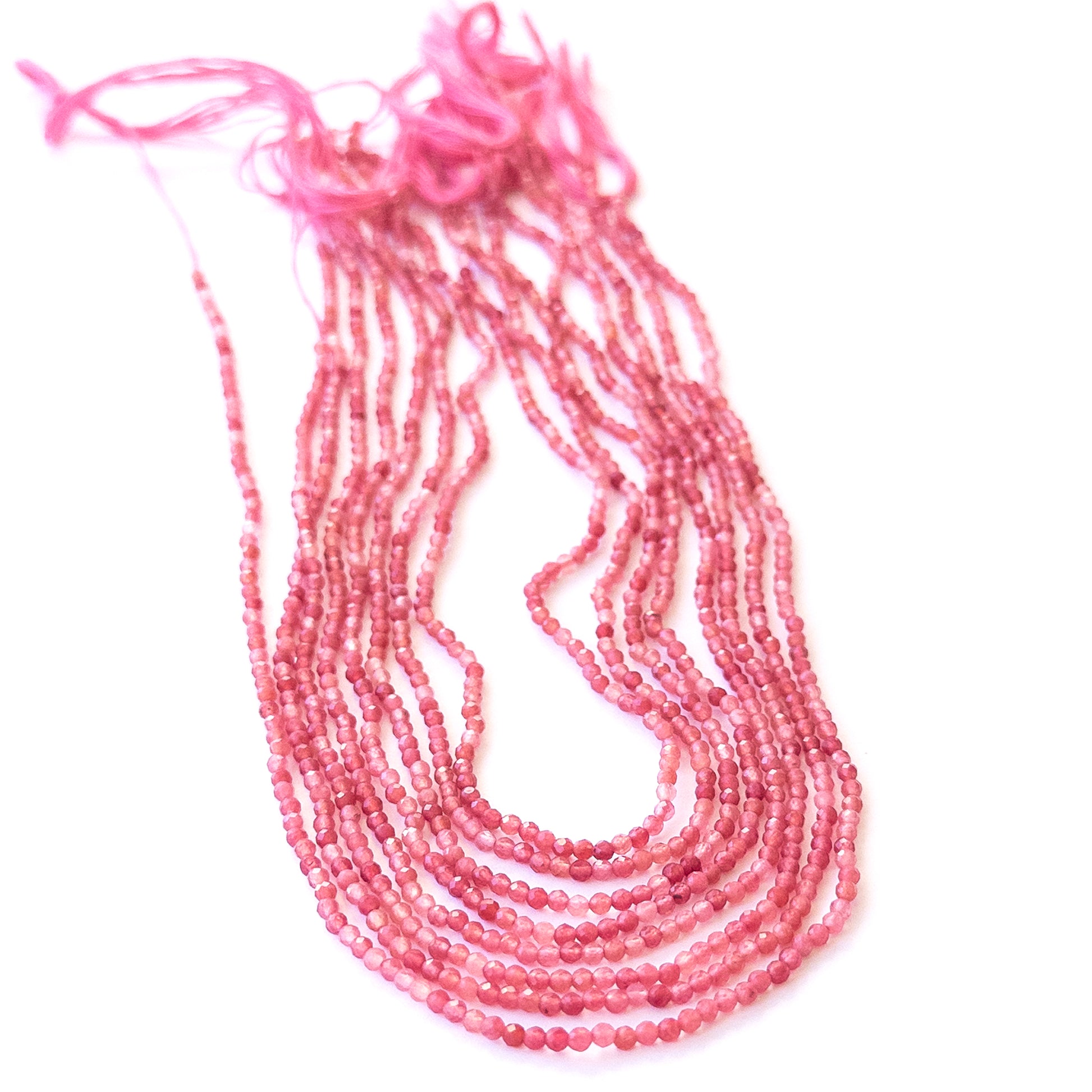 High‑quality Pink Strawberry Quartz rondelle beads arranged neatly for gemstone jewellery making.