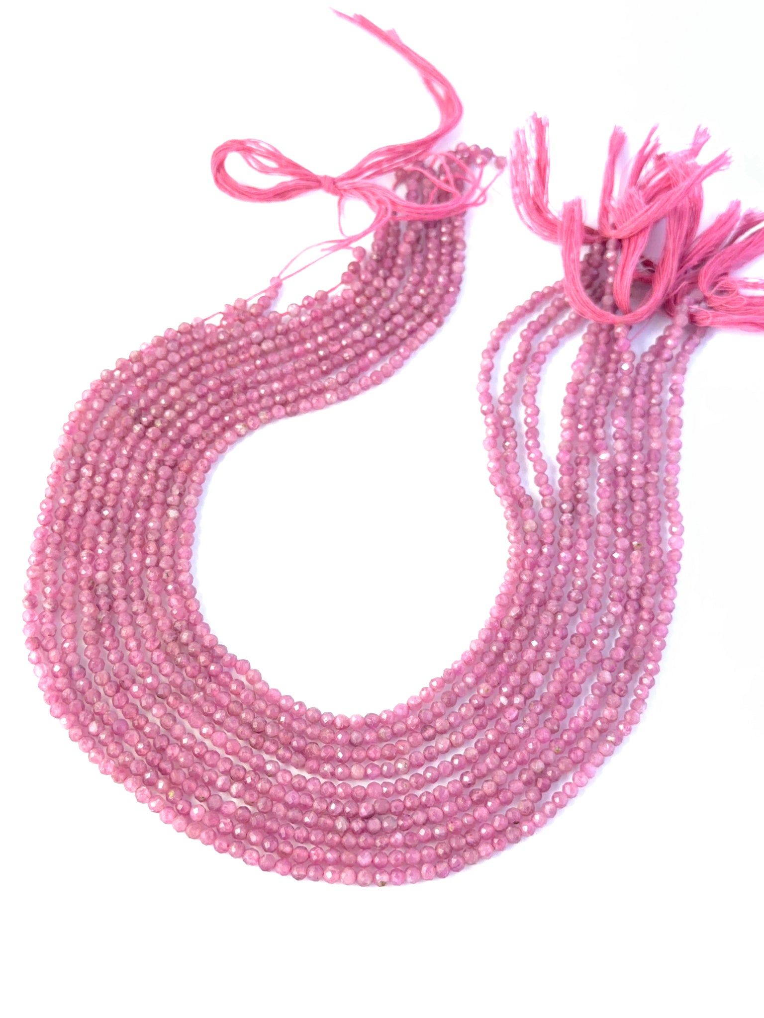Pink Tourmaline faceted rondelle stone beads showing soft rosy colour and sparkle for genuine gemstone beads in DIY jewellery.