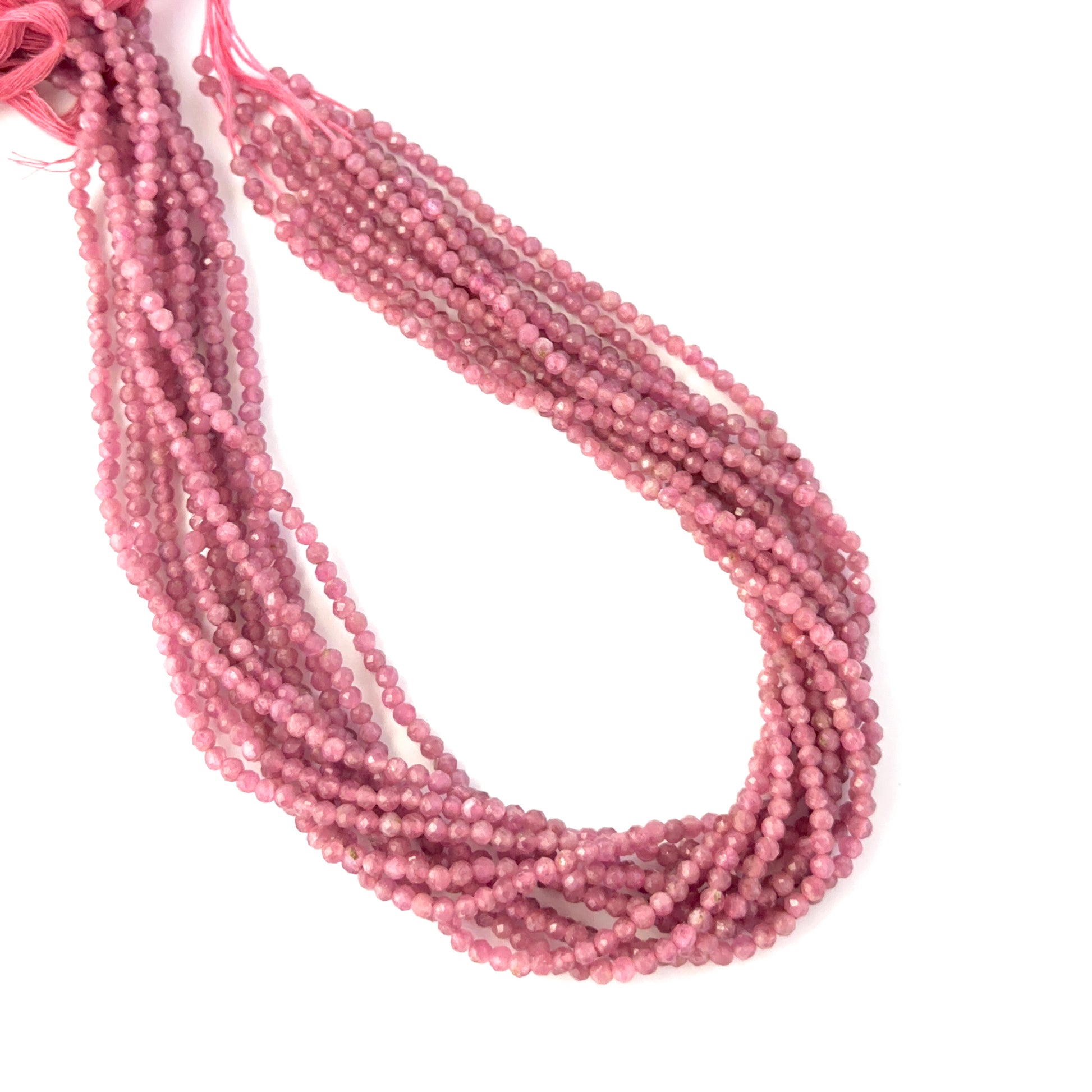 Pink Tourmaline faceted rondelle beads in a uniform strand, displaying vibrant pink tones and premium gemstone quality.