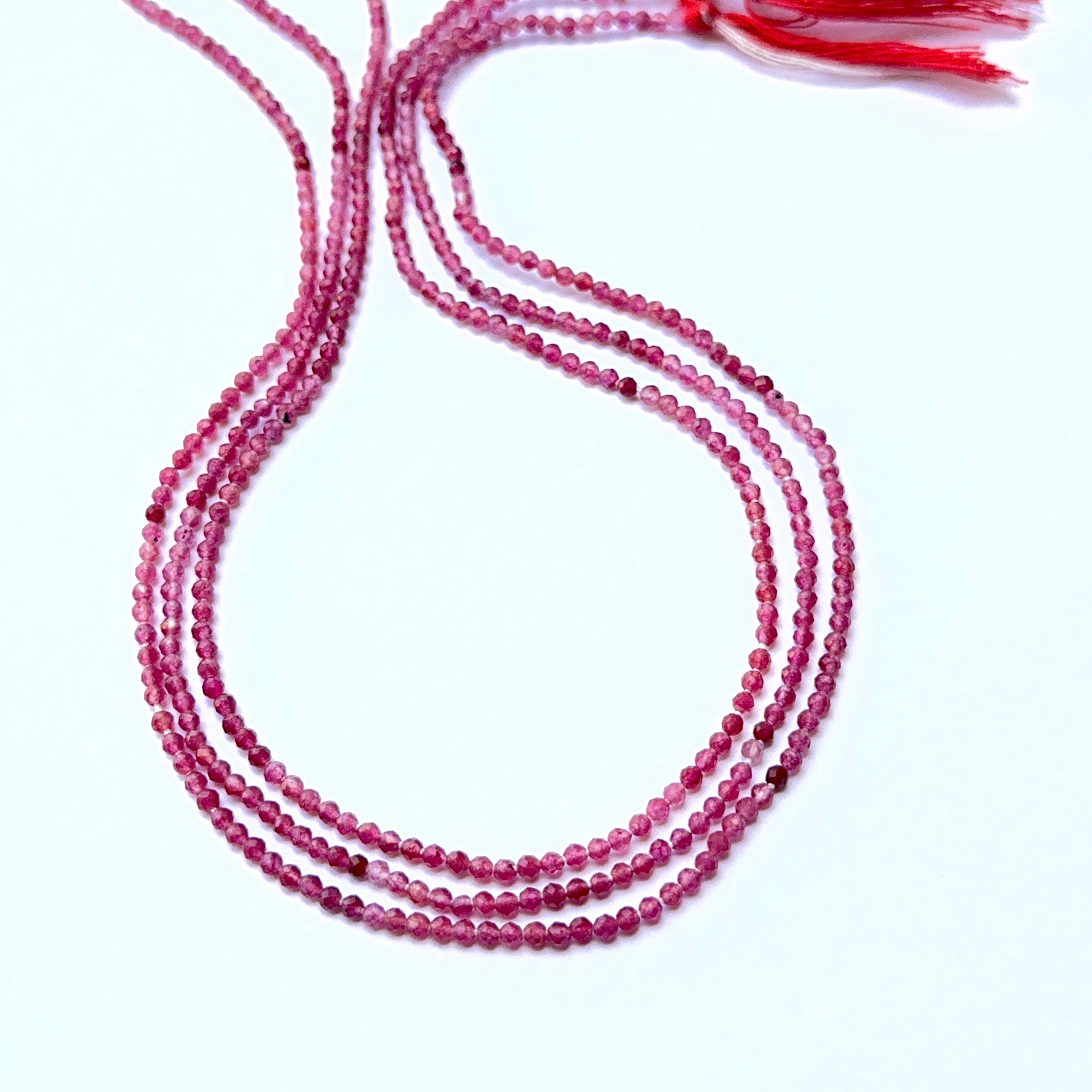 Close‑up of Pink Tourmaline stone beads in tiny faceted rondelle cut, highlighting shine and clarity for handmade jewellery components.