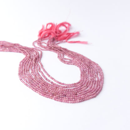 Authentic Pink Tourmaline gemstone beads displaying delicate faceting and vivid rosy clarity.