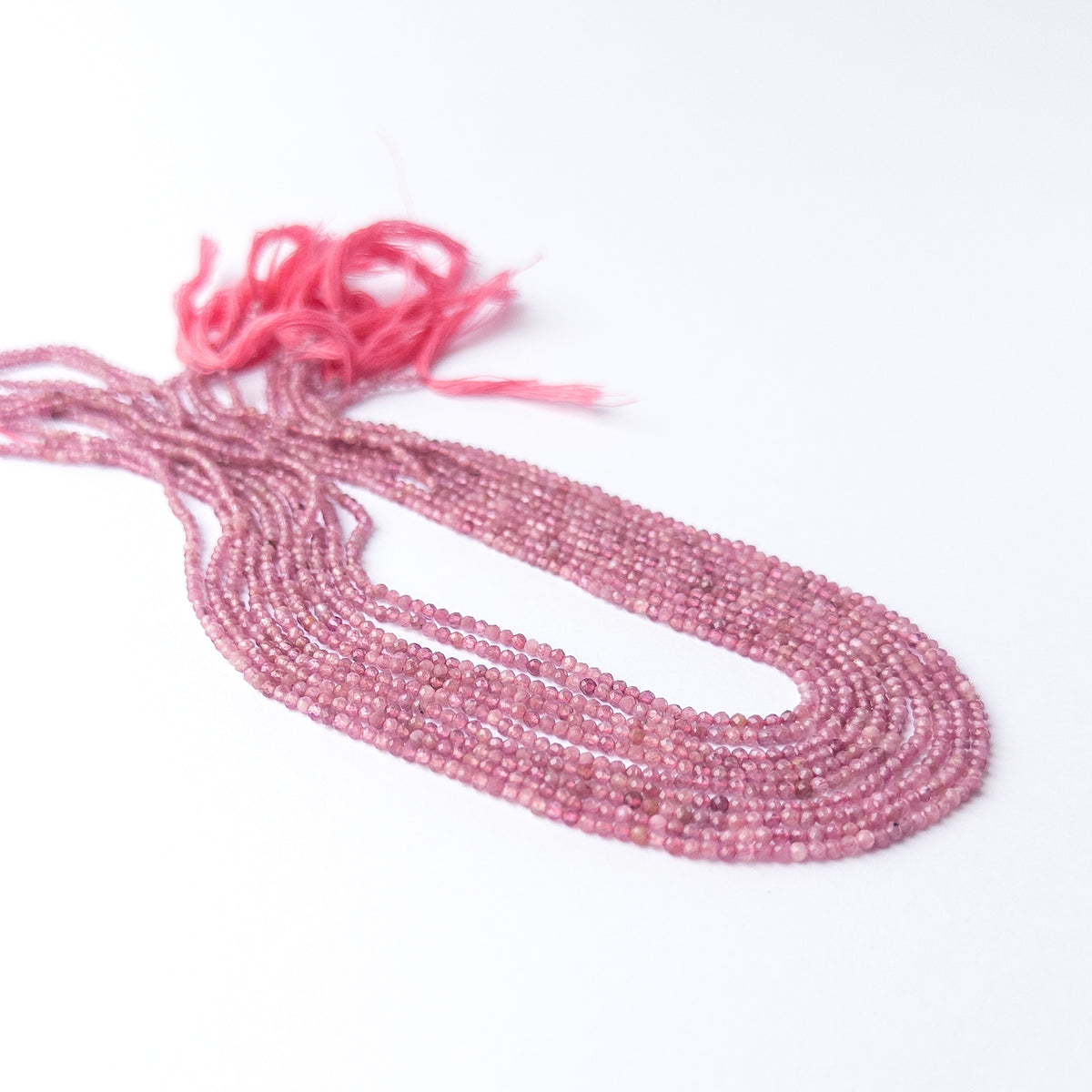 Pink Tourmaline faceted rondelle beads in uniform 2.2mm size for handmade jewellery components.