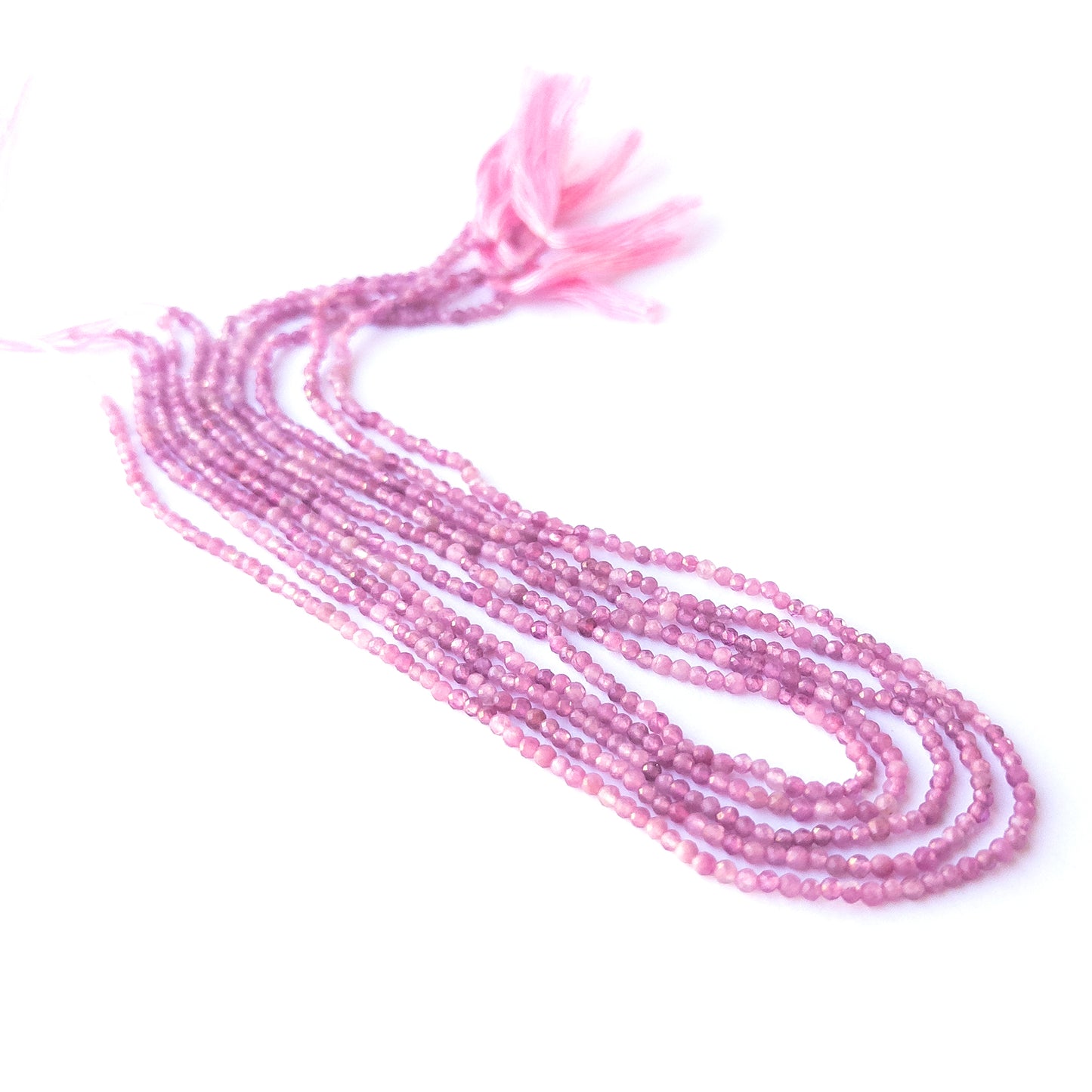 Close‑up of genuine Pink Tourmaline faceted rondelle beads showing their shine, clarity, and delicate 2.4–2.5mm cut.