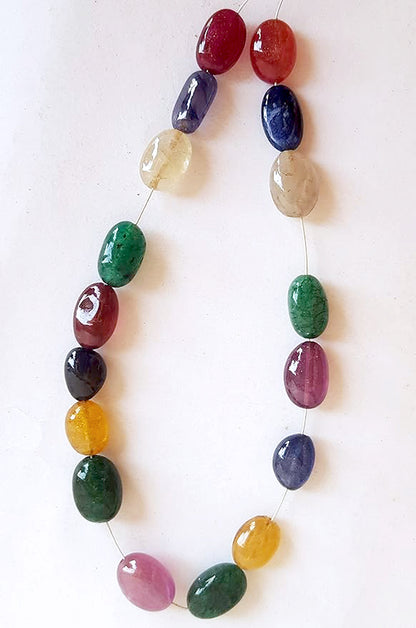  A vibrant multi-coloured strand featuring precious ruby, blue sapphire, yellow sapphire, and emerald beads on a white background.