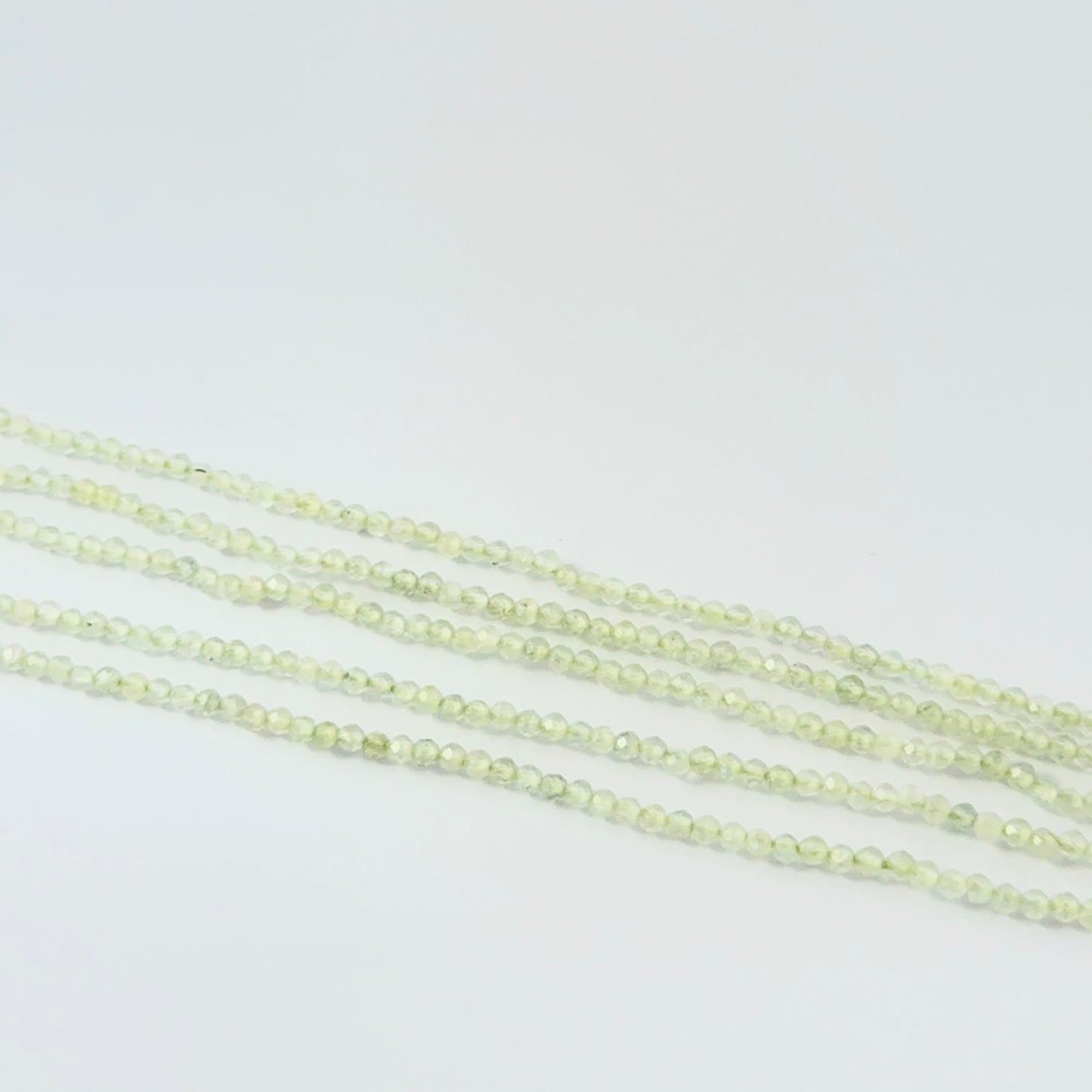 32cm strand of small faceted Prehnite rondelle beads for delicate jewellery designs.