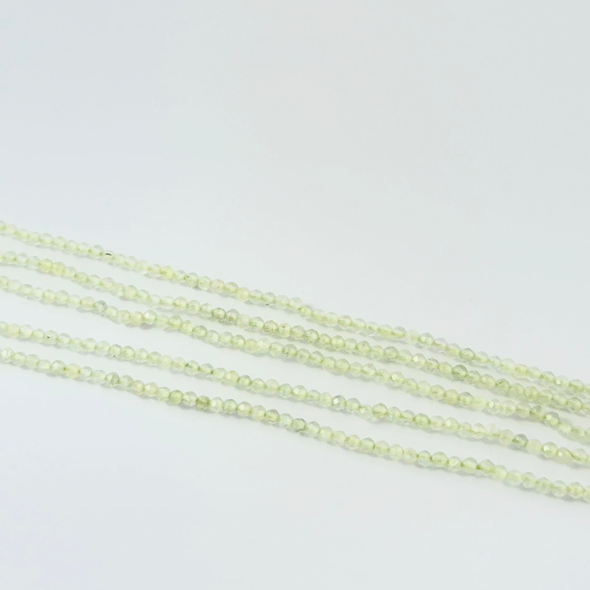 32cm strand of small faceted Prehnite rondelle beads for delicate jewellery designs.
