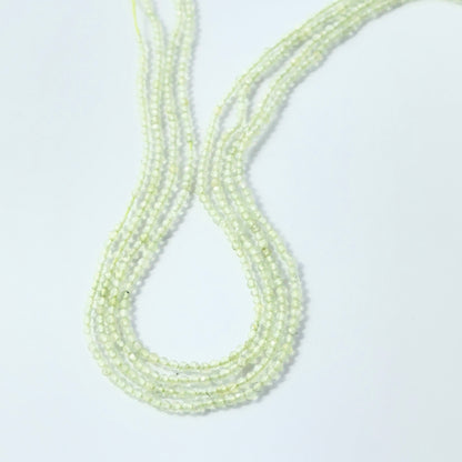 Sparkling Prehnite rondelle beads, 2.2mm size, ideal for necklaces and bracelets.