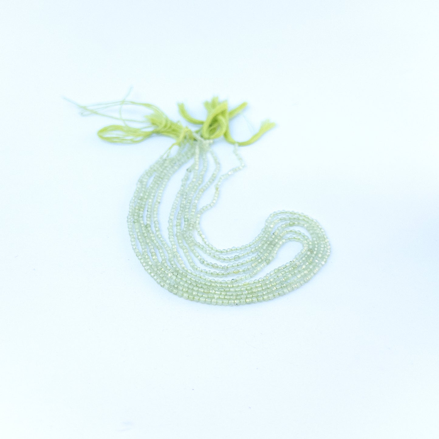 prehnite faceted rondelles displaying pale green colour and quality cut for gemstone beads