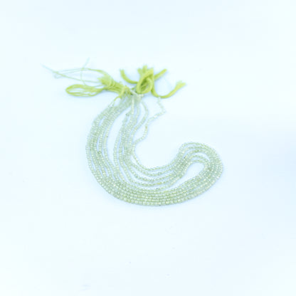 prehnite faceted rondelles displaying pale green colour and quality cut for gemstone beads