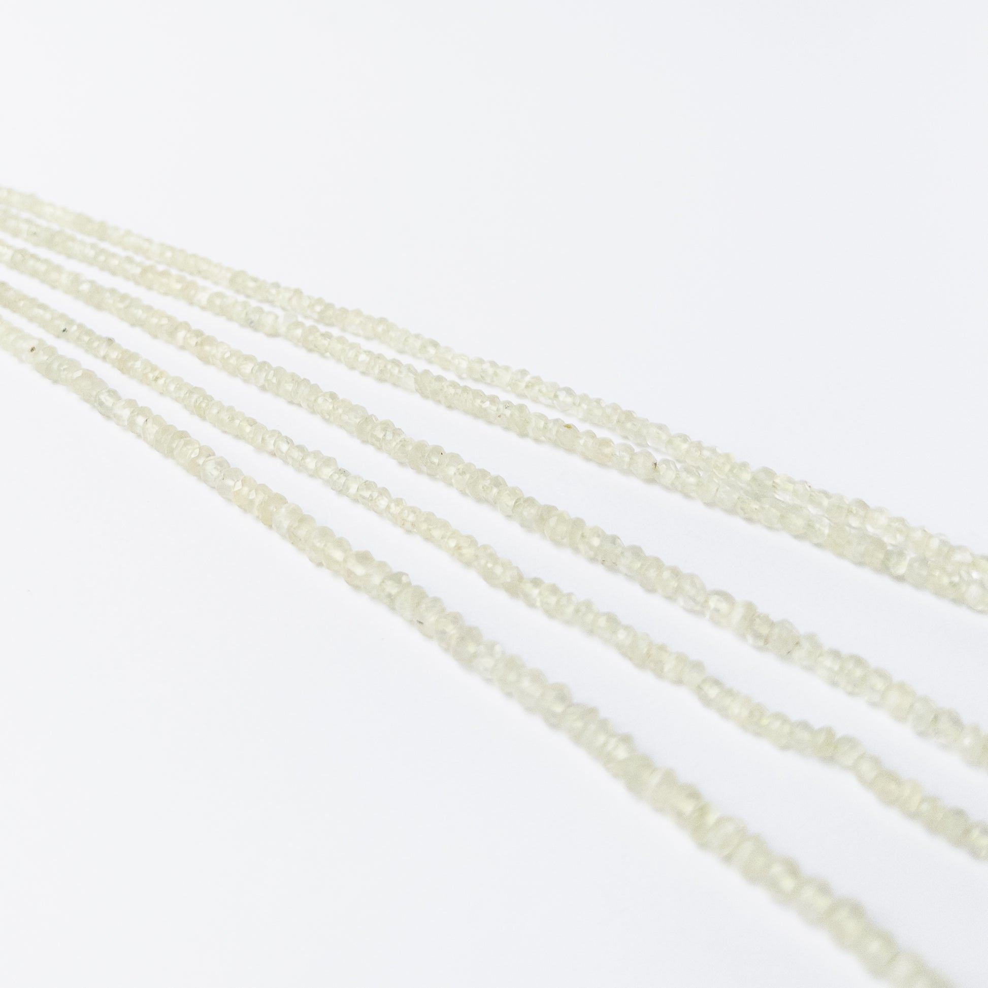 Faceted Prehnite rondelle beads with pale green hues, perfect gemstone beads for DIY jewellery making.
