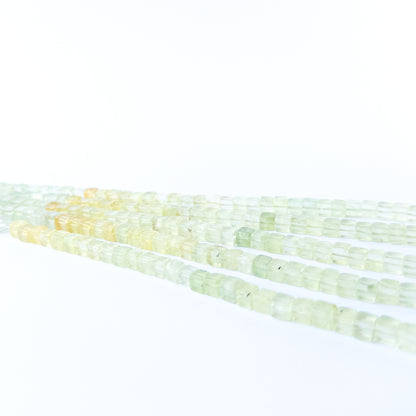 Authentic Prehnite gemstone beads showcasing calming green colour and smooth cube shaping for jewellery designers.