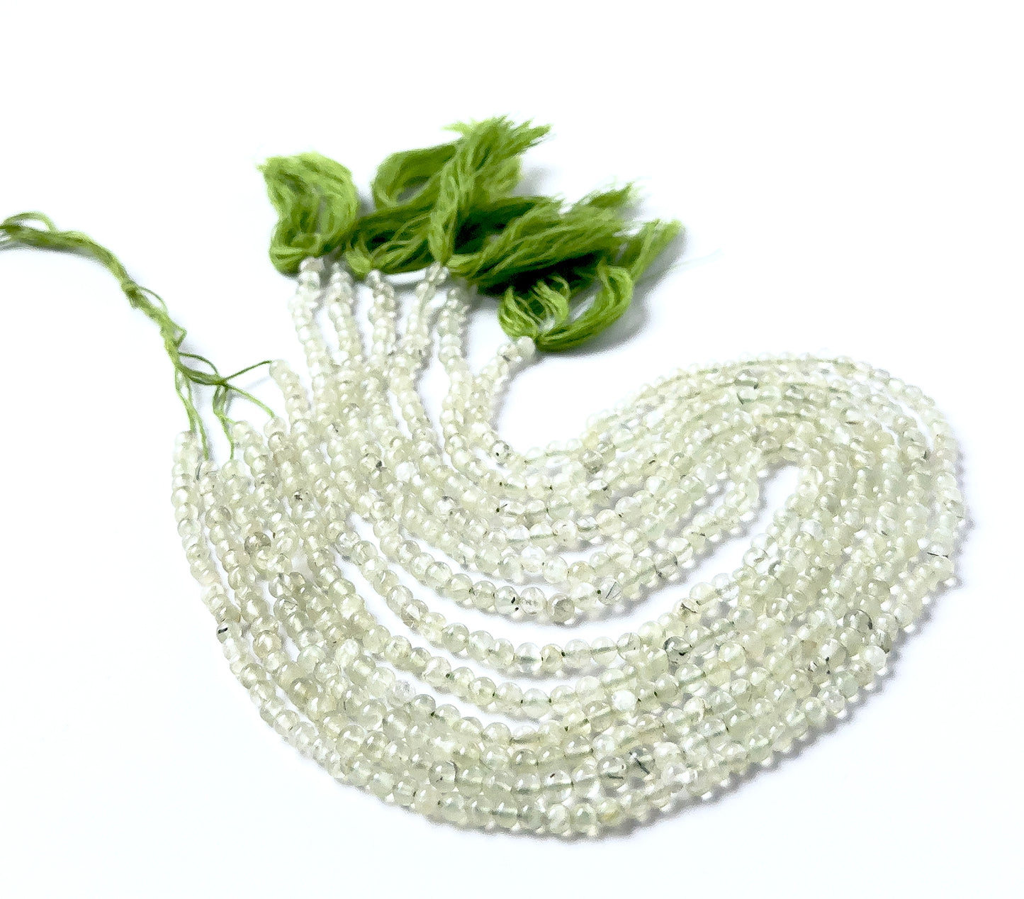 Prehnite smooth round beads sized 4–4.3mm arranged in a 34cm strand, showing soft green translucence and a polished finish.